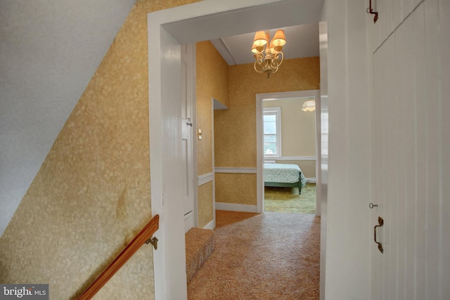 8029 Molly Pitcher Hwy, Shippensburg, PA 17257 - hallway with carpet floors, a chandelier, and wallpapered walls