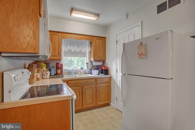 8029 Molly Pitcher Hwy, Shippensburg, PA 17257 - kitchen with white appliances, light countertops, and light flooring