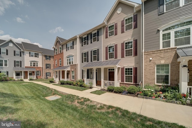 18316 Reaper Hill Ct, Triangle, VA 22172 - view of property with a porch, a front yard, and a residential view