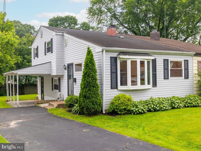 2868 Senak Rd, Abington, PA 19001 - view of front of home with a chimney, asphalt driveway, and a carport