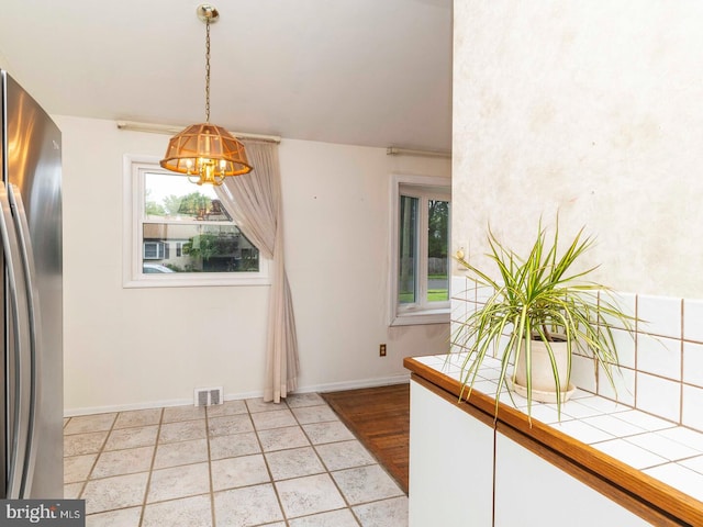 2868 Senak Rd, Abington, PA 19001 - unfurnished dining area with a chandelier and baseboards