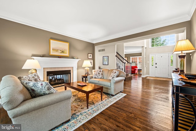 1 Ralph Marsh Dr, Glen Mills, PA 19342 - living area with crown molding, stairway, a tiled fireplace, and wood finished floors