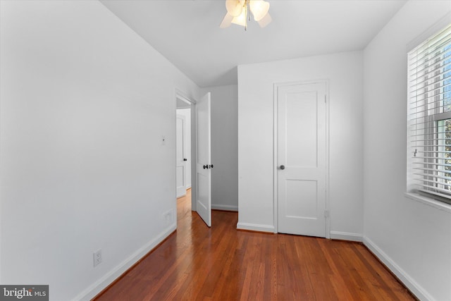 733 S Fayette St, Alexandria, VA 22314 - unfurnished bedroom with wood finished floors, multiple windows, and ceiling fan