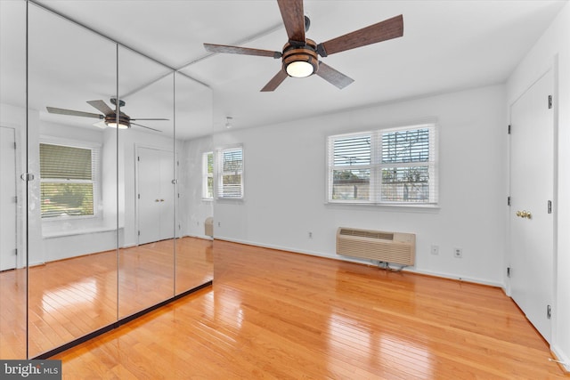 733 S Fayette St, Alexandria, VA 22314 - unfurnished bedroom with hardwood / wood-style flooring and a wall unit AC