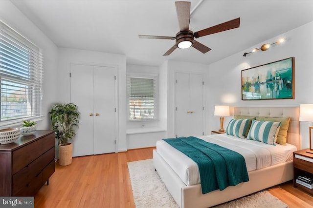 733 S Fayette St, Alexandria, VA 22314 - bedroom featuring two closets, light wood-style flooring, and ceiling fan