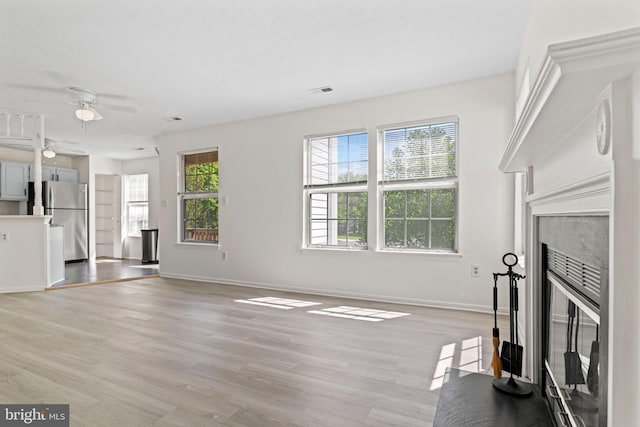 31 Beagle Run Unit 88, Nottingham, MD 21236 - unfurnished living room featuring a ceiling fan and light wood-style floors