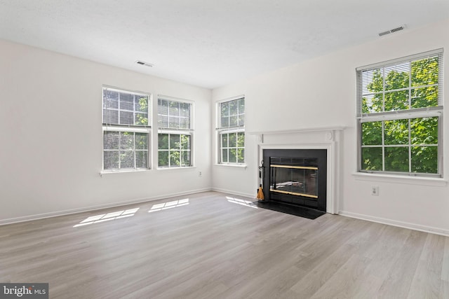 31 Beagle Run Unit 88, Nottingham, MD 21236 - unfurnished living room featuring wood finished floors and a fireplace with flush hearth