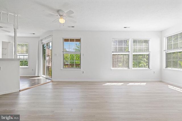 31 Beagle Run Unit 88, Nottingham, MD 21236 - unfurnished living room with ceiling fan, healthy amount of natural light, and wood finished floors