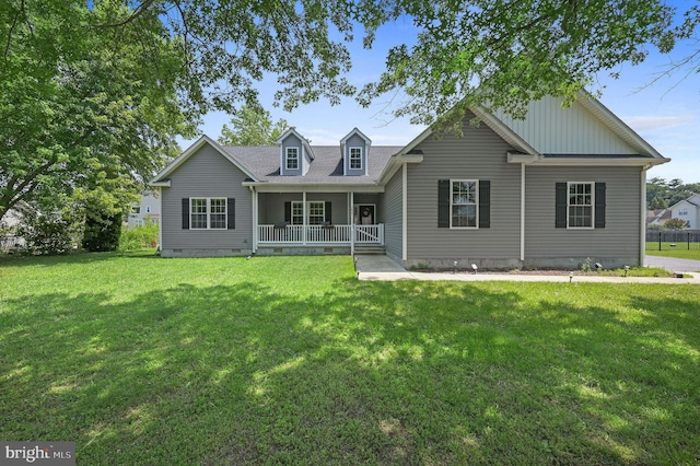 29 E Inner Cir, Dover, DE 19904 - view of front of home with crawl space, covered porch, a front lawn, and board and batten siding
