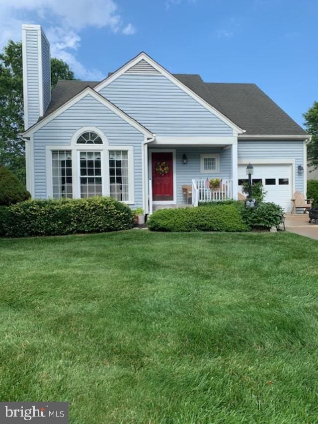 9 Bentley Dr, Sterling, VA 20165 - view of front of property with a front yard, a garage, a chimney, a porch, and driveway