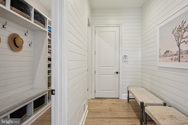 41550 Hepatica Ct, Ashburn, VA 20148 - mudroom featuring wood walls and light wood finished floors