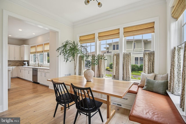 41550 Hepatica Ct, Ashburn, VA 20148 - dining room featuring healthy amount of natural light, light wood-style flooring, crown molding, and recessed lighting