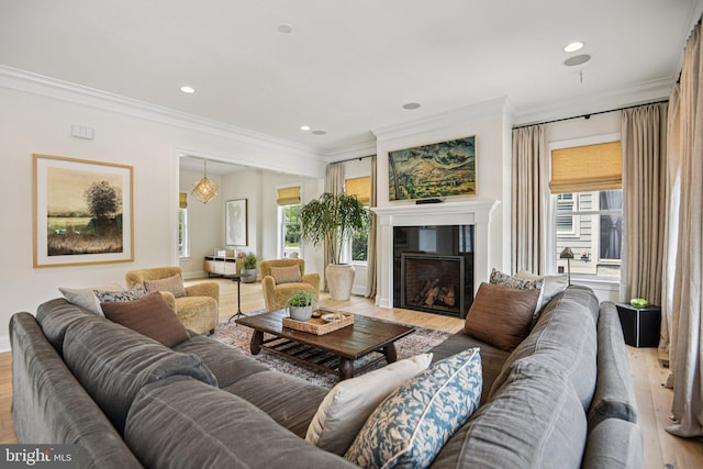 41550 Hepatica Ct, Ashburn, VA 20148 - living room with ornamental molding, light wood finished floors, plenty of natural light, a fireplace, and recessed lighting