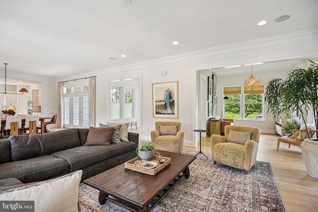 41550 Hepatica Ct, Ashburn, VA 20148 - living area featuring light wood-style flooring, crown molding, and recessed lighting