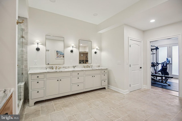41550 Hepatica Ct, Ashburn, VA 20148 - bathroom featuring double vanity and a shower stall
