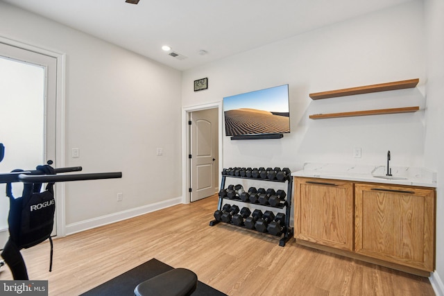 41550 Hepatica Ct, Ashburn, VA 20148 - exercise room with light wood-style flooring and wet bar