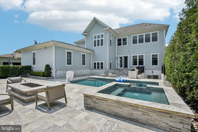 41550 Hepatica Ct, Ashburn, VA 20148 - view of swimming pool with a patio area, an outdoor fire pit, and a pool with connected hot tub