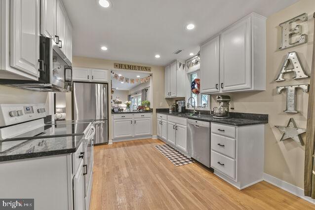 32 Hamilton Terrace Dr, Hamilton, VA 20158 - kitchen featuring stainless steel appliances, white cabinetry, light wood finished floors, and recessed lighting