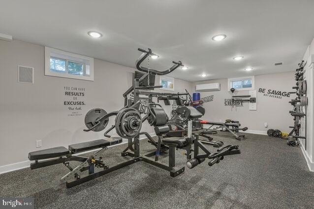 32 Hamilton Terrace Dr, Hamilton, VA 20158 - exercise room featuring an AC wall unit, recessed lighting, and plenty of natural light