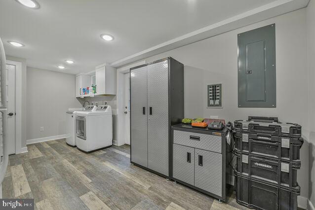 32 Hamilton Terrace Dr, Hamilton, VA 20158 - laundry area featuring washing machine and dryer, electric panel, cabinet space, light wood-type flooring, and recessed lighting