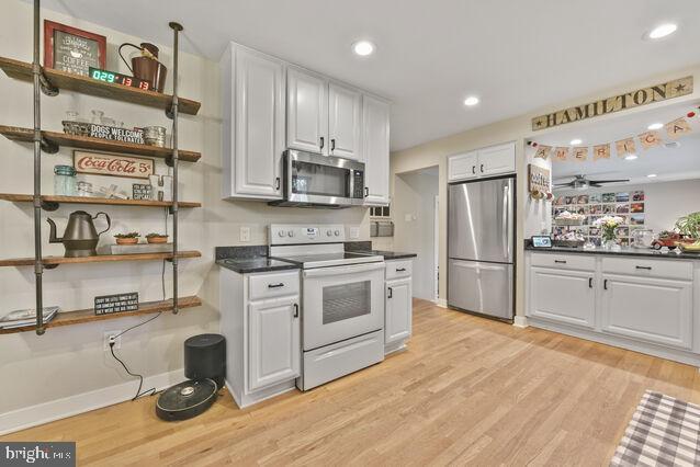 32 Hamilton Terrace Dr, Hamilton, VA 20158 - kitchen featuring appliances with stainless steel finishes, light wood finished floors, open shelves, white cabinetry, and recessed lighting