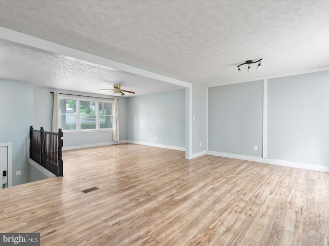 237 Lakeview Dr, Cross Junction, VA 22625 - unfurnished living room with wood finished floors, a textured ceiling, and ceiling fan