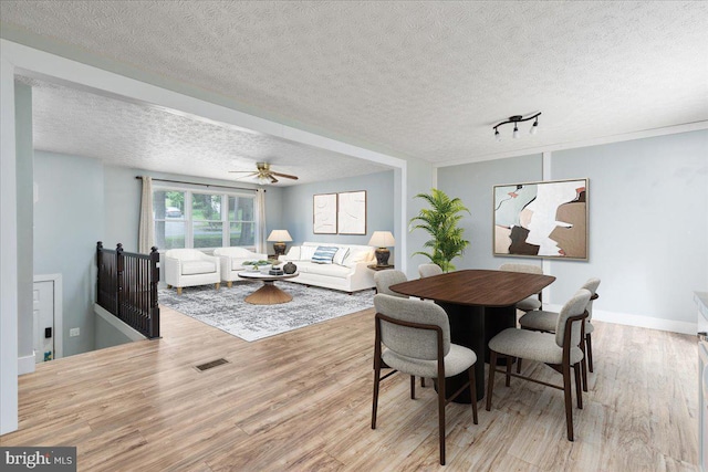 237 Lakeview Dr, Cross Junction, VA 22625 - dining space featuring wood finished floors, a textured ceiling, and a ceiling fan