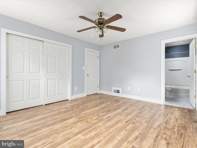 237 Lakeview Dr, Cross Junction, VA 22625 - unfurnished bedroom featuring light wood-style floors, ensuite bathroom, a closet, and ceiling fan