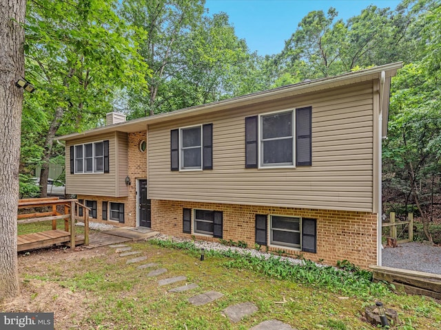 237 Lakeview Dr, Cross Junction, VA 22625 - bi-level home featuring a chimney, brick siding, and a deck