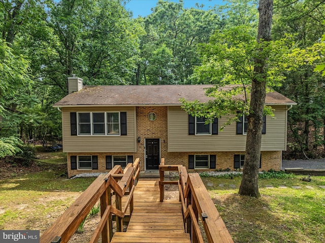 237 Lakeview Dr, Cross Junction, VA 22625 - split foyer home with a chimney, brick siding, a shingled roof, and a front yard