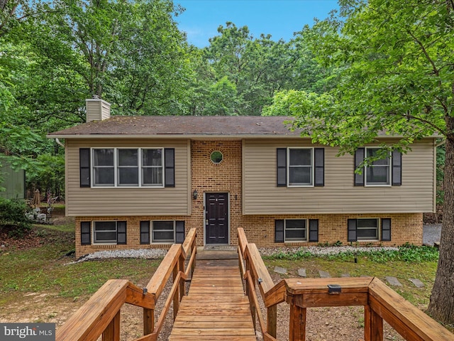 237 Lakeview Dr, Cross Junction, VA 22625 - split foyer home featuring a chimney and brick siding