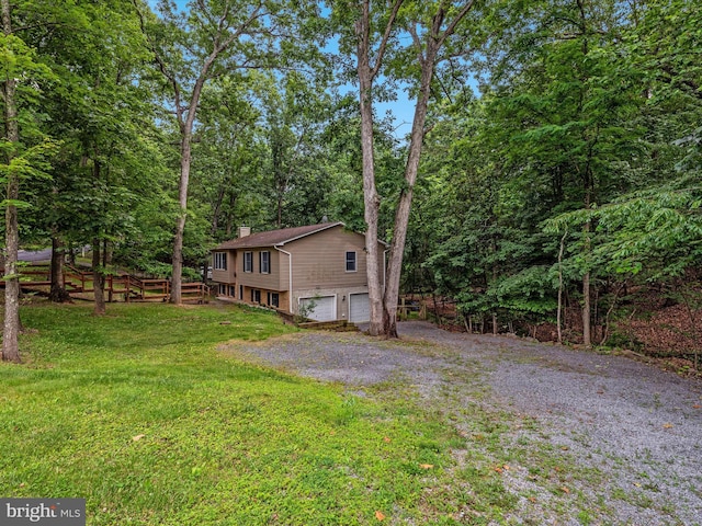 237 Lakeview Dr, Cross Junction, VA 22625 - view of home's exterior with a chimney, a garage, driveway, and a yard