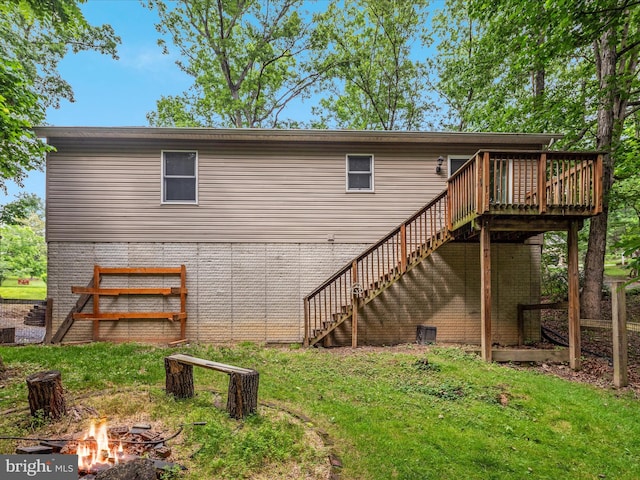 237 Lakeview Dr, Cross Junction, VA 22625 - rear view of house with a fire pit, stairs, a deck, a yard, and brick siding