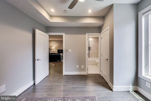 625 Park Rd NW Unit 206, Washington, DC 20010 - unfurnished bedroom with wood finished floors, multiple windows, recessed lighting, and ensuite bathroom