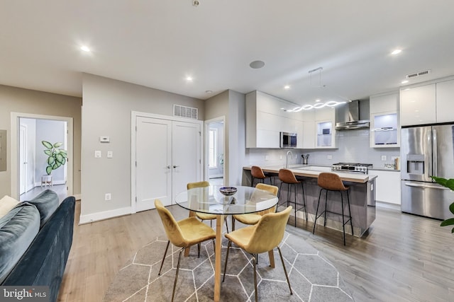625 Park Rd NW Unit 206, Washington, DC 20010 - dining room featuring light wood-style flooring and recessed lighting