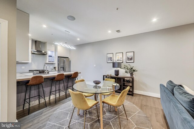 625 Park Rd NW Unit 206, Washington, DC 20010 - dining room featuring light wood-style floors and recessed lighting