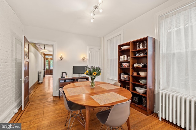 2116 Green St, Philadelphia, PA 19130 - dining space featuring radiator and light wood-style floors