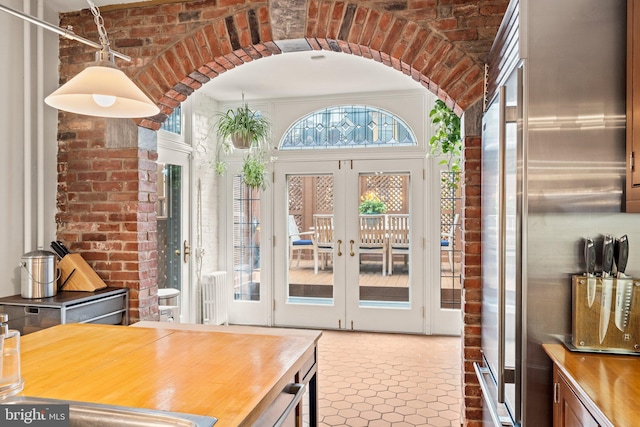 2116 Green St, Philadelphia, PA 19130 - interior space with butcher block countertops, high quality fridge, french doors, and arched walkways