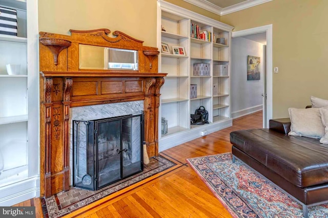 2116 Green St, Philadelphia, PA 19130 - living room with ornamental molding, wood finished floors, and a high end fireplace