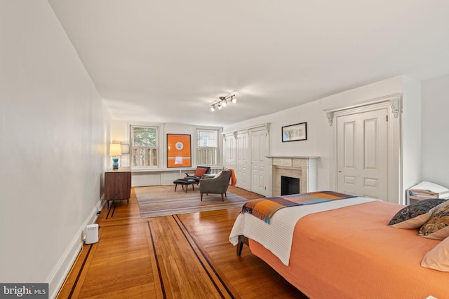 2116 Green St, Philadelphia, PA 19130 - bedroom featuring wood finished floors and a fireplace