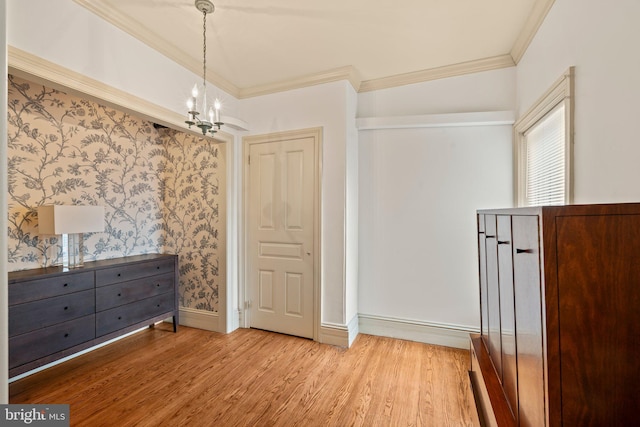 2116 Green St, Philadelphia, PA 19130 - unfurnished bedroom featuring a chandelier, light wood-style floors, and ornamental molding