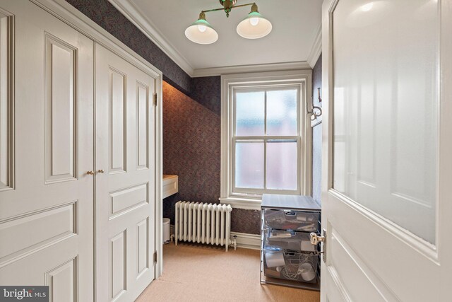 2116 Green St, Philadelphia, PA 19130 - hall featuring radiator, wallpapered walls, ornamental molding, and light colored carpet