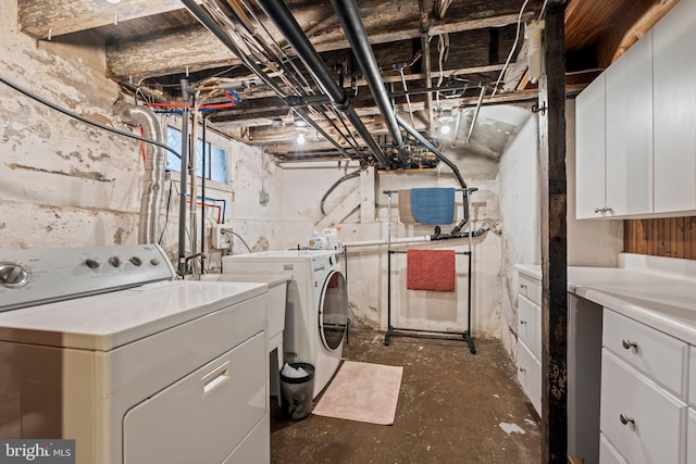 2116 Green St, Philadelphia, PA 19130 - laundry area featuring cabinet space and washer and clothes dryer