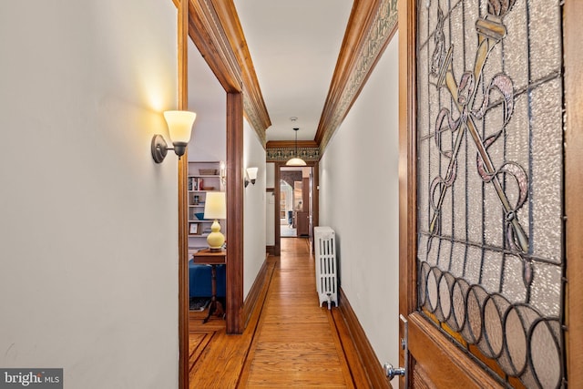 2116 Green St, Philadelphia, PA 19130 - hallway featuring radiator, light wood finished floors, and ornamental molding