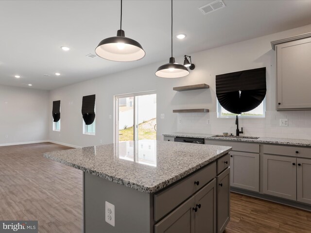 76 Diving Scaup Rd, Hedgesville, WV 25427 - kitchen featuring gray cabinets, decorative backsplash, dark wood finished floors, a center island, and open floor plan