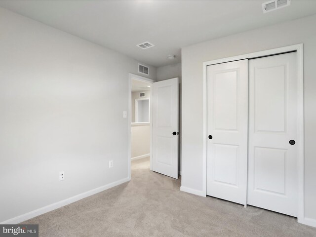 76 Diving Scaup Rd, Hedgesville, WV 25427 - unfurnished bedroom featuring light colored carpet and a closet