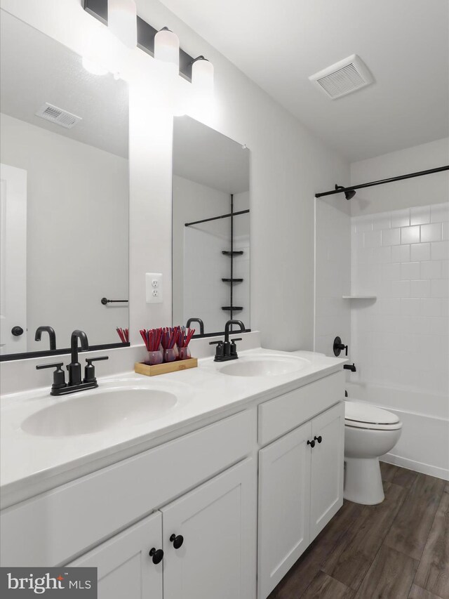 76 Diving Scaup Rd, Hedgesville, WV 25427 - bathroom featuring double vanity, wood finished floors, and shower / bathtub combination