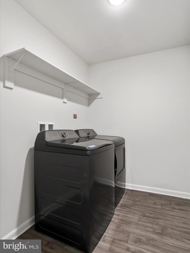 76 Diving Scaup Rd, Hedgesville, WV 25427 - washroom featuring independent washer and dryer and wood finished floors