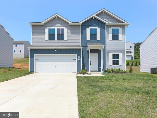 76 Diving Scaup Rd, Hedgesville, WV 25427 - view of front of property featuring a front lawn, concrete driveway, a garage, and board and batten siding