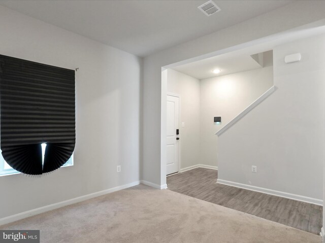 76 Diving Scaup Rd, Hedgesville, WV 25427 - carpeted empty room with baseboards and wood finished floors